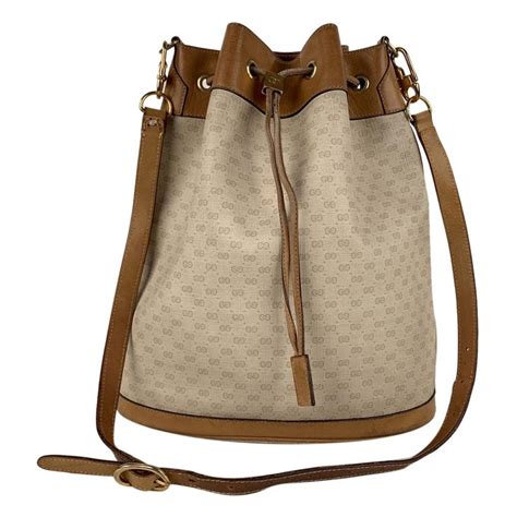 gucci drawstring pouch|Gucci small bucket bag.